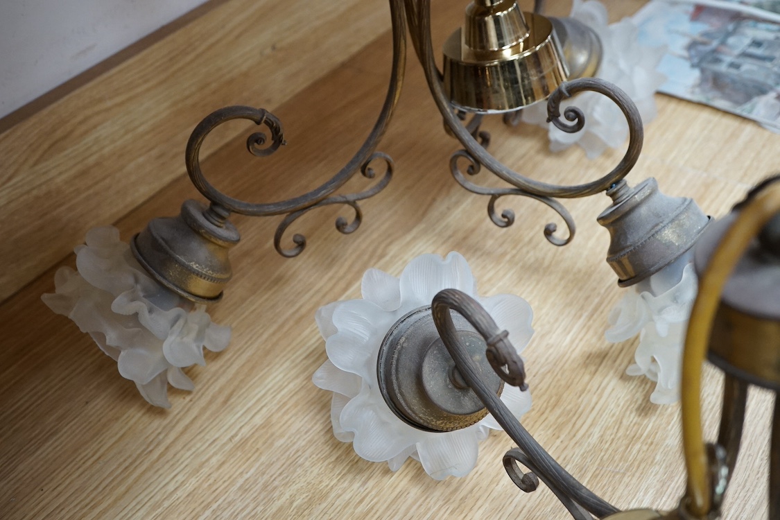 A pair of brass three-light chandeliers with frosted glass shades, 58cm wide. Condition - fair
